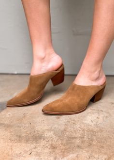 Hop on the TREND TRAIN with these super cute Pointed Toe Suede Mules. The color is chef's kiss for fall. Comfortable enough for all day wear, these new mules from Matisse will become your go to this season. The heel is not too high and the style is perfect. If you live in the south, this will be a good shoe for most of the winter. Suede upper Manmade outsole 2.5 in/6.35 cm heel Textile lining Padded insole Leather stacked heel Imported Trendy Brown Slip-on Mules, Brown Pointed Toe Mules With 4-inch Heel, Brown Slip-on Mules For Fall, Stacked Heel Slip-on Mules, Chic Spring Clogs With 4-inch Heel, Trendy Closed Toe Mules For Work, Suede Mules With Stacked Block Heel, Spring Clogs With 4-inch Open Heel, Stacked Heel Leather Mules In Medium Width