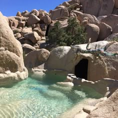 there is a small cave in the rocks by the pool that looks like it's going to fall into the water