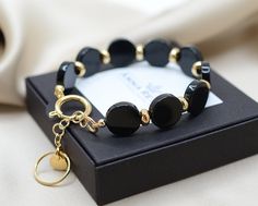 Elegant Onyx Bracelet for women. Black Onyx Gems are known for their healing power and protection against negative energy. Subtle, powerful and super easy to wear everyday. *Diameter of the beads 14mm *The length from M to XXL"(6,5-8") of your choice(see size chart) + 1"extension chain(2,5cm) ➜ Please message me if you would like a different size bracelet. - Anti Tarnish ⭐️ Hypoallergenic ⭐️ Nickel free ------------------------------------------- You could make perfect unique set with earrings: Onyx Bracelet Women, Elegant Gold Agate Crystal Bracelet, Minimalist Onyx Bracelets As Gift, Minimalist Onyx Bracelets For Gift, Modern Onyx Bracelets As Gift, Modern Onyx Bracelets For Gifts, Modern Onyx Bracelets For Gift, Adjustable Onyx Bracelet Gift, Black Jewelry With Extender As A Gift