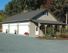 a two car garage is shown in front of some trees