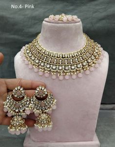 *Light Weight Gold Kundan Adjustable necklace set with earrings and tikka. *Studded with kundan stone. *Light Weight Gold kundan necklace. *Necklace width-  2.1 inches (included pearl drop) *Earrings Length- 3.2 inches(included pearl drop) *Earrings width- 1.8 inches *Dome size- 1 inches Pink Heavy Temple Jewelry Bridal Necklace, Heavy Pink Temple Jewelry Bridal Necklace, Pink Chandbali Bridal Necklace For Festivals, Pink Temple Jewelry Bridal Necklace For Reception, Pink Hand Set Bridal Necklace In Temple Jewelry Style, Pink Chandbali Bridal Set For Festive Occasions, Heavy Pink Bridal Necklace For Party, Pink Jewelry For Reception And Festivals, Pink Round Jewelry Sets For Wedding