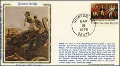 a postcard with an image of a man on a motorbike in the background