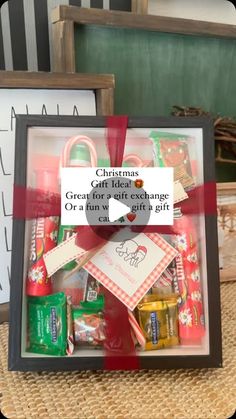 a box filled with candy and candies on top of a table