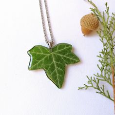 This real ivy necklace is a unique creation from my forest jewelry collection. A beautiful green leaf necklace as the perfect gift for Mother's day. This green leaf necklace is truly original and unique: I have dried the ivy leaf and then covered it with crystalline resin to provide a perfect shine. Take this forest leaf necklace always with you to feel really unique! You will never go unnoticed wearing this real ivy necklace: Its elegance, beauty and class will make you shine on any occasion, w Ivy Necklace, Rustic Wedding Jewelry, Organic Necklace, Fantasy Pendant, Forest Gift, Forest Necklace, Cottagecore Gifts, Forest Jewelry, Woodland Jewelry