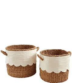 two white and brown baskets with scalloped handles