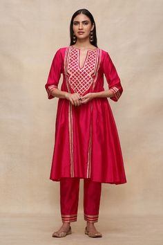 Rani pink gathered kurta featuring gota embroidery in a geometric pattern, Fit: Relaxed Fitted Traditional Wear With Geometric Embroidery For Transitional Season, Fitted Traditional Wear With Geometric Embroidery, Festive Traditional Wear With Geometric Embroidery, Festive Eid Kurta With Geometric Embroidery, Festive Sets With Geometric Embroidery For Diwali, Festive Diwali Set With Geometric Embroidery, Diwali Fitted Kurta With Geometric Embroidery, Elegant Festive Sets With Geometric Embroidery, Kurta Women