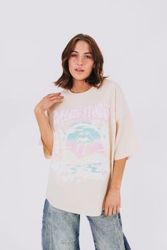 Add some groovy vibes to your wardrobe with this Rolling Stones tee! Featuring an iconic graphic and an oversized fit, this tee is perfect for music lovers and fashionistas alike. Don't miss out on this must-have piece for your collection. Details Rolling Stones graphic Oversized fit Sizing Approximate measurements: SIZE LENGTH BUST Small 29" 50" Medium 29" 52" Large 30" 54" Fabric has stretchModel is 5’8 wearing small Material 100% CottonWash with similar colorsHang dry Trendy Screen Print Top For Music Festival, Trendy Summer Concert T-shirt, Trendy T-shirt For Summer Concert, Trendy Summer T-shirt For Concert, Trendy Graphic Design Tops For Concert, Casual Graphic T-shirt For Music Festival, Trendy Graphic Print Tops For Music Festival, Trendy Crew Neck Tops For Music Festival, Spring Concert T-shirt With Graphic Design