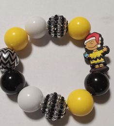 Elastic bracelet with yellow black silver beads. Brown Christmas, Charlie Brown Christmas, Christmas Bracelet, Elastic Bracelet, Yellow Black, Charlie Brown, Silver Beads, Black Silver, Jewelry Bracelets