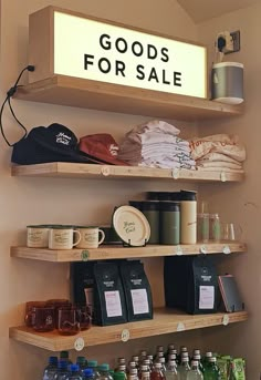 shelves with goods for sale on them in a retail store or coffee shop that is open to the public