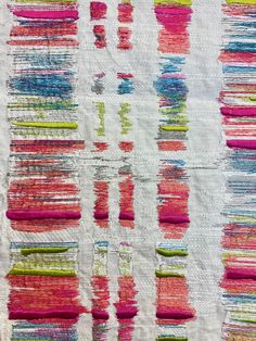 a piece of fabric with different colored lines on it