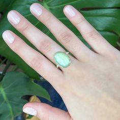 Rosecut prehnite set in 14k gold on a sterling silver hand sculpted band. Accented by two brilliant white diamonds. Emily handpicks each stone in our Hudson Valley studio. Approximate stone size: 20mm x 14mm Mohs hardness: 6-6.5 Each piece is handmade with love in our Hudson Valley studio. In order to highlight each stone's color and vibrance most of our gemstone jewelry is backed in nickel free sterling silver. Please allow for slight variations in stone size, color and shape. Turquoise Chrysoprase Ring, Polished Chrysoprase Ring, Polished Chrysoprase Ring Jewelry, Handmade Green Chrysoprase Ring, Chrysoprase Ring, Local Jewelry, Hudson Valley, White Diamonds, Diamond White