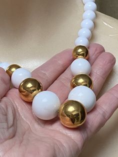 "You must have at least one set of white jewelry just for summer. White pearls don't count. I'm talking fun stuff. Necklace is signed Napier and earrings signed Trifari. Necklace will extend from 16 to 18\" with a hook clasp. Largest front beads are about 18 and 20mm round. They continue to be fairly big at about 10mm near clasp. Earrings are clip backs marked Trifari. Big look at 3\" but the largest section is against the earlobe. Not heavy anyway but I think the largest bead at top is a good i White Large Beads Costume Jewelry Necklace, Costume Jewelry With Large Beads And Multi-strand, White Jewelry Set, White Multi-strand Large Beads Jewelry, Graduated Pearl Necklace, Clasp Earrings, White Multi-strand Large Beads, Luxury Pearl White Multi-strand Necklace, Big Necklace