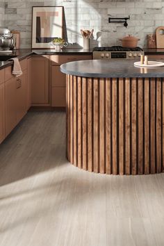 a kitchen with wooden cabinets and counter tops