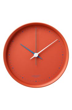 an orange clock with blue hands on a white background