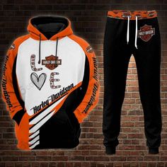 an orange and white harley davidson hoodie and sweatpants are shown in front of a brick wall