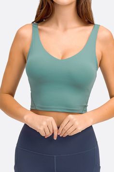 The Deep V-Neck Crop Sports Bra is a great option for the sports-minded woman. This bra features a deep v-neck, wireless cups, and removable padding. With a sheer design, this bra is great for layering under your favorite tops. Sizing: True to size Pattern: Solid Features: Sleeveless, removable padding, wireless, crop Neckline: Deep V-neck Sheer: No Stretch: Highly stretchy Product measurements: Size 4: length 15 in, bust 26 in, hem width 24 in Size 6: length 15 in, bust 28 in, hem width 25 in S Formal Cocktail Dress, Activewear Sets, Yoga Bra, Spring Outfits Women, Body Dress, Sport Bra, Active Wear Leggings, Size Pattern, Sports Bra Sizing