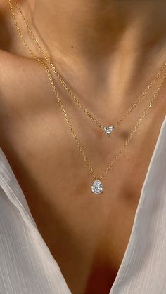 Opt for elegance with our water drop charm necklace. The water drop charm is delicate and feminine, making this piece ideal for layering and creating a bohemian-chic look. CZ gemstones with 18k premium triple plated gold stainless steel. So luminous that it rivals the stars. Details: 18K Vermeil Premium Stainless Steel CZ Gemstones Length: 16" chain + 2" extender 100% Eco-Friendly; No Nickel, Chromium and Lead 💦 Water-resistant, sweat-proof, hypoallergenic and tarnish-free. You can work out in Delicate Teardrop Pendant Chain For Layering, Elegant Teardrop Drop Necklace For Layering, Dainty Cubic Zirconia Drop Necklace, Dainty Teardrop Pendant Necklace For Layering, Teardrop Cubic Zirconia Jewelry With Adjustable Chain, Teardrop Cubic Zirconia Necklace With Adjustable Chain, Cubic Zirconia Teardrop Necklace With Adjustable Chain, Dainty Drop Necklace With Cubic Zirconia, Everyday Teardrop Gold Plated Necklace