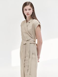 This is a trendy and feminine dress by NILBY P that is made out of high quality and sturdy material. With distinctive mood of the design and comfortable wear, you can style it for your casual daily outfit.- Light weight without lining- Adjustable strap on the waist- Feminine and modern mood Chic Fitted Cotton Belted Dress, Fitted Beige Wrap Dress For Summer, Elegant Beige Linen Workwear Dress, Chic Fitted Beige Linen Dress, Chic Belted Wrap Dress For Day Out, Beige Fitted Wrap Dress For Summer, Spring Linen Mini Dress For Work, Fitted Beige Belted Dress For Summer, Fitted Beige Belted Summer Dress