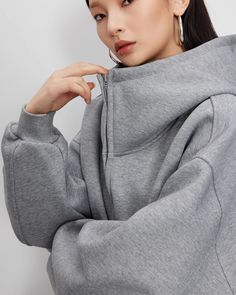 A zip hoodie with a distinctive high neck.

Although it is thick, it is soft and has an attractive texture that feels good to the touch.

It can also be used as a light outerwear for your usual coordination.
◾️Model
Height/Weight：170cm(66.9in)
Fitting Size：M
◾️Material
cotton　87％
polyester　13％



Size (cm)
Length
Chest
Shoulder
Sleeve Length


S
65.6
131
60.5
51.5


M
66.5
135
61.5
52.5


L
67.5
139
62.5
53.5 Oversized Funnel Neck Winter Hoodie, Winter Nylon Hoodie With Double-lined Hood, Scuba Oversized Funnel Neck Half-zip, Light Outerwear, Big Hoodie, Functional Long-sleeve Nylon Hoodie, Big Hoodies, Nylon Long Sleeve Hoodie With Double-lined Hood, Height And Weight