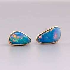 Minimalist Free Shaped Australian Doublet Opal Stud Earrings 18K Yellow Gold. Free Domestic USPS First Class Shipping! Free Gift Bag or Box with every order!Opal—the queen of gemstones, is one of the most beautiful gemstones in the world. Every piece of opal is unique in its own ways and patterns. We only use high-quality Natural Opals (NO synthetics or imitations) for our jewelry. ----------------------------------------------------------------------------------------------------ABOUT THIS PROD Formal Opal Gemstone Earrings, Yellow Gold Opal Gemstone Earrings, Opal Promise Ring, Rings For Couples, Australian Black Opal, Opal Stud Earrings, Beautiful Gemstones, Opal Birthstone, Promise Rings For Couples