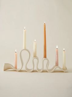 five candles are lined up in a row