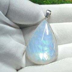 "Natural Moonstone Pendant, 925 Sterling Silver Pendant, Rainbow Fire Necklace, Bohemian Pendant, Wedding Pendant, Anniversary Gift For Her   Gemstone : Moonstone  Metal : 925 Sterling Silver Purity : 925 Parts Of 1000 Style : Boho & Hippi  Jewelry Type : Handmade  Pendant Size Width : 26 mm  Height : 8 mm Length : 49 mm Why Wear Silver As a metal, silver has significant health benefits that have been used across cultures for centuries. Silver has a proven track record as a powerful antimicrobial agent fighting infection and aiding in cold and flu prevention wound healing, and more. Silver also helps with internal heat regulation and circulation. ♥ Packaging: All jewelry comes in a beautiful and careful packaging 🛍 If the item is going directly to the gift recipient please leave us a note White Mystical Pendant Jewelry, Mystical White Pendant Jewelry, Bohemian Drop Jewelry For Wedding, White Moon-shaped Wedding Necklace, Bohemian White Moon-shaped Jewelry, Bohemian White Moon Shaped Jewelry, Mystical Teardrop Sterling Silver Jewelry, Silver Spiritual Gemstones For Wedding, Spiritual Silver Gemstones For Weddings