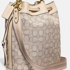 This Is A New Coach Bucket Bag 2 Way. 11”W 10h.Fabric Monogram With Leather Trim .Leather Top Handle With Adjustable Crossbody Strap.Hardware Is Gold.Comes With Dustbag Chic Monogram Canvas Satchel With Gold-tone Hardware, Chic Monogram Canvas Satchel With Detachable Strap, Chic Monogram Canvas Satchel With Dust Bag, Chic Monogram Canvas Bag With Adjustable Strap, Chic Monogram Canvas Satchel For Errands, Bags With Gold-tone Hardware And Monogram Canvas, Beige Monogram Canvas Crossbody Satchel, Beige Monogram Canvas Satchel Bag, Chic Monogram Canvas Bags