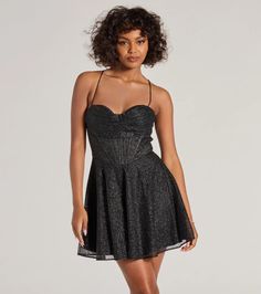 Enchant with gorgeous glamour in the Leah glitter mesh skater dress featuring a sleeveless sweetheart neckline with a built-in padded bust, a draped pleated overlay, a corset bodice with flexible boning for structure, and a lace-up back design for a customized fit. The high waist seam flows out to a short skater fit-and-flare silhouette.Fit & FeaturesSheer glitter mesh fabric with satin woven lining, no stretchSweetheart neckline with padded bust, draped pleated overlayCorset bodice with fle Party Fit And Flare Corset Dress With Lined Bodice, Party Dress With Corset Back And Fit And Flare, Fit And Flare Party Dress With Corset Back, Party Fit And Flare Dress With Corset Back, Chic Fit And Flare Corset Dress For Party, Night Out Mini Dress With Sweetheart Neckline, Fit And Flare Mini Corset Dress For Party, Glamorous Spaghetti Strap Corset Dress For Night Out, Glamorous Lurex Prom Dress