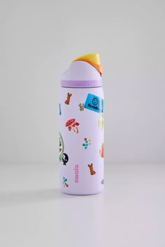 a white and purple bottle with animals on it