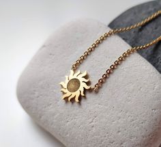 This amazing dainty sun necklace is such a great piece of every jewelry collection. The sunburst charm just brings good luck and happiness, good karma. This small gold sun pendant can be layered with other celestial necklace or worn on it's own. Pendant Size: 1.2 cm x 1.2 cm All my jewellery is lead and nickle free. I am attaching the minimalist sun charms on gold chain, which I cut to size to create something pretty just for you.   ✽ ENVIRONMENTAL FRIENDLY PACKAGE I was always feeling bad for creating more waste on this planet so I try to be environmental friendly everywhere where possible. All my wrapping material is biodegradable and recyclable :) My jewelry comes on A6 designed paper in a biodegradable cellophane bag which can either go to compost or landfills as it will disappear in a Dainty Sun And Moon Charm Necklaces As A Gift, Dainty Sun And Moon Charm Necklace For Gift, Dainty Sun And Moon Charm Necklace Gift, Dainty Sun And Moon Design Charm Necklace As Gift, Sun Design Pendant Necklace Gift, Dainty Sun Design Jewelry For Gifts, Sun-shaped Jewelry With Sun And Moon Design For Gift, Sun Design Pendant Jewelry As Gift, Minimalist Sun Design Necklace As Gift