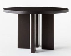 a black table with two wooden poles on the top and one is round in shape