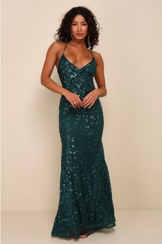 Get ready for 'gram-worthy pics all night when you're in the Lulus Photo Finish Forest Green Sequin Lace-Up Maxi Dress! Shiny green sequins create a floral design atop sheer mesh as it shapes this sultry dress that sweeps from tying straps that lace-up across a sexy open back and into a deep V-neckline and a darted bodice with padded cups. A high empire waist flows into a figure-skimming mermaid maxi skirt. Hidden back zipper. Fit: This garment fits true to size. Length: Floor length. Size mediu Sultry Dress, Emerald Green Prom Dress, Forest Green Dresses, Embellished Maxi Dress, Lulus Dresses, Formal Dresses Gowns, Sequin Maxi Dress, Maxi Dress Wedding, Green Prom Dress