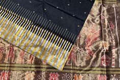 exclusive black sambalpuri silk saree from the weavers of Odisha. This handmade Odisha silk has an exclusive kathiphera border design in gold and silver tissue silk. The anchal is handweaved with tissue silk with intricate sambalpuri ikkat motifs, The saree comes with blouse piece Elegant Black Saree With Border, Black Silk Handloom Dupatta, Black Art Silk Dupatta With Border, Festive Black Dupatta With Weaving Work, Ceremonial Black Silk Dupatta, Black Chanderi Dupatta With Weaving Work, Black Art Silk Traditional Wear With Border, Black Tussar Silk Saree With Motifs, Black Silk Handloom Saree