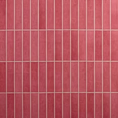 a red tiled wall with white lines on it