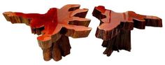 two pieces of wood that have been cut into smaller shapes with red paint on them