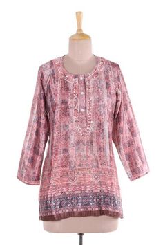 In hues of petal pink and linen intricate vines and floral motifs are printed onto this tunic from India. Shalabh designs this lovely tunic which features floral motifs around the button-up neckline that are hand-embroidered from cotton. Ear Cuff Jewelry, Cotton Handbag, Pink Tunic, Master Artists, Embroidered Tunic, Clothes Shopping, Fashion Over 40, Cotton Voile, Dress Pant