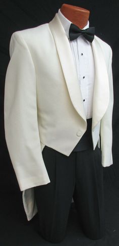 NEW IVORY TUXEDO TAILCOAT Two Button Front with Satin Shawl Lapels. Traditional Tails in the Back. Durable & Machine Washable Polyester. High Quality Made in the USA! Please note these feature a zipper inside the coat underneath the lapels.  Not visible while worn I just thought I should mention it.  Listing is for the tailcoat only.  Please visit my eBay Store if you are interested in additional formal wear items. Single Breasted Long Sleeve Tuxedo For Wedding, Single Breasted Long Sleeve Wedding Tuxedo, Fitted White Tuxedo With Buttons, White Fitted Tuxedo With Buttons, Cream Long Sleeve Tuxedo For Formal Occasions, Elegant Winter Wedding Tuxedo, White Single Button Wedding Blazer, White Single Button Blazer For Wedding, Classic Long Sleeve Tuxedo For Wedding