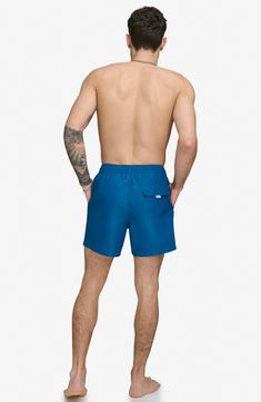 Soak up the sun in these recycled-fiber swim trunks built with UPF 40+ sun protection. 5" inseam (size Medium) Elastic/drawstring waist Front slant pockets; back patch pocket Lined 100% REPREVE polyester REPREVE recycled polyester is made from 100% post-consumer recycled plastic bottles Machine wash, tumble dry Imported Beach Swimwear With Drawstring In Nylon, Beachwear Swimwear With Built-in Shorts For Outdoor, Nylon Drawstring Swimwear For Beach, Solid Nylon Swim Trunks With Drawstring, Nylon Swimwear With Drawstring For Beach Season, Outdoor Swim Trunks With Drawstring, Short Length, Outdoor Swim Trunks With Drawstring, Moisture-wicking Nylon Beachwear Swimwear, Outdoor Swim Trunks In Recycled Polyester