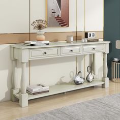 a white console table with two drawers on each side and an open shelf below it