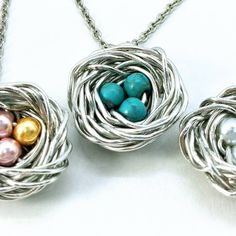 "This Bird's Nest necklace is beautiful way to express love of family. You design the necklace. Select birthstone colors as seen in the 2nd to last picture. THIS WILL NOT TARNISH Each necklace is made to order by me in my workshop. Only offered in silver tone. ☆HOW TO ORDER 1. Select Size from dropdown 2. Select Style from dropdown 3. Under Personalization, tell me the color(s) beads you want; for example: 1 Jan, 2 Oct, or maybe you like the Robins Egg Bead, so just say \"robins egg\" (Please be Silver Round Bead Necklaces For Mother's Day, Silver Round Beads Necklace For Mother's Day, Handmade Necklaces For Mother's Day Crafting, Birds Nest Necklace, Love Of Family, Mother's Day Jewelry, Express Love, Steel Stamp, Plastic Envelopes