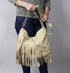 LEATHER BOHO BAG FRINGE LEATHER BAGSoft zippered leather bag.This Handbag is the perfect size to carry your daily essentials in style! It is made from high quality leather.This leather bag is a perfect everyday bag! There is a lot of space and you can put there everything in your everyday life.* Different colors* Lining* An external pocket on the back* Includes internal pockets for mobile phone and other small items.Dimensions:height: 31 cm (12.2 in)width: 39 cm (15.3 in)strap: max 130 cm (51.2 Beige Fringe Tote Shoulder Bag, Beige Fringe Shoulder Bag For Travel, Beige Fringe Shoulder Bag For Daily Use, Beige Fringed Hobo Bag For Daily Use, Beige Fringe Hobo Bag For Daily Use, Beige Fringe Bag For Shopping, Beige Fringe Shopping Bag, Beige Fringe Shoulder Bag For Shopping, Beige Leather Bags With Fringe