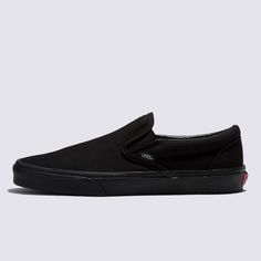 The Slip-On that’s been Setting Trends Since 1979All black everything. Vans #98 has been an integral part of the Vans line-up since its release in 1979, but these all-black Slip-On sneakers raise the style stakes to another level while keeping the focus on comfort and accessibility. The low-profile canvas uppers and supportive paddle collars make sure of that. The Classic Slip-On has come a long way since it first erupted on the scene, but the mix of comfort and style remains timeless. Iconic Sl Classic Slip-on Skate Shoes For Streetwear, Black Urban Vans Sneakers, Urban Black Vans Sneakers, Classic Black Sneakers With Rubber Toe Cap, Classic Black Low-top Skate Shoes, Urban Black Slip-on Skate Shoes, Black Casual Slip-on Skate Shoes, Casual Black Slip-on Skate Shoes, Vans Black Sneakers With Gum Sole