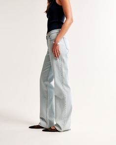 Our classic low rise baggy jeans in a light wash with a clean hem. This fit features a 8.5” low rise, is slightly relaxed at waist and hips, and eases at the thigh into a baggy, full-length leg shape. We recommend buying your true size for a baggier fit. Size down for a closer fit. This jean is made from our vintage stretch fabric which features both an authentic vintage look and contains slight built-in stretch for additional comfort. Modern Light Wash Mid-rise Bottoms, Modern Mid-rise Light Wash Bottoms, Chic Light Wash Bottoms With Straight Hem, Classic Faded Wide Leg Bottoms, Light Wash Bottoms With Straight Fit And Hem, Classic Faded Bottoms For Spring, Modern Light Wash Denim Bottoms, Light Wash Wide Leg Bottoms With Straight Fit, Light Wash Straight Fit Bottoms With Standard Cut Leg