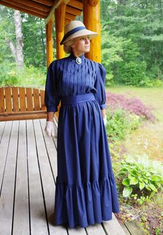 Classic Edwardian styled cotton very versatile 3-piece set! The blouse has shoulder to hem vertical pleating, 3/4 length full sleeves gathered to a cuff, button back, and center front split turn back collar. The skirt has a wide flounce with an elastic waist. The waist is wrapped with a matching cotton belt. Designed and made by Recollections in America. 100% cotton. Hand or machine wash cold gently; hang or tumble dry low. Leisa is wearing a brooch, hat, gloves, and boots and they are priced se Edwardian Woman, Edwardian Blouse, Edwardian Dress, Ankle Length Skirt, Future Outfit, Edwardian Fashion, Full Sleeves, Lace White Dress, Classic Outfits