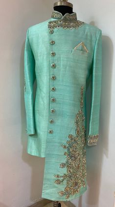 Raw silk sherwani.sherwani with heavy zardozi hand work done on one side and also on neckline .with stylish button it gives you elegant look. Colour options available. Includes-sherwani with pajamas Embroidered Semi-stitched Jamawar Sherwani, Semi-stitched Raw Silk Sherwani With Embroidery, Semi-stitched Raw Silk Sherwani With Intricate Embroidery, Semi-stitched Embroidered Raw Silk Sherwani, Western Outfits For Men, Semi-stitched Gold Jamawar Sherwani, Wedding Outfits Indian, Mens Ethnic Wear, Mens Wear Wedding