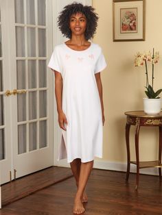 This adorable nightgown is specifically designed to be loose fitting and carefree, so you feel totally at home whenever you’re in it. The casual style allows you to move freely, without tightness or other restrictions. And thanks to a forgiving cut and generous drape, fabric won’t linger keeping things airy and breathable. Plus, you can showcase your silhouette in a way that makes you comfortable. Speaking of comfort, your skin will sing at the touch of our silky-smooth 100% pima cot Comfortable Cotton Nightgown For Lounging, White Relaxed Fit Nightgown For Sleep, Casual White Nightgown For Lounging, White Cotton Nightgown For Lounging, White Feminine Sleepwear For Relaxation, White Relaxed Fit Nightgown, Relaxed Fit Short Sleeve Bedtime Dress, Summer Short Sleeve Nightgown For Lounging, Comfortable Nightgown For Spring Lounging