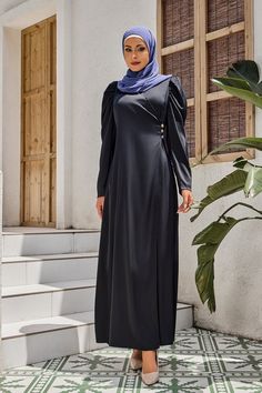 The Black Criss Cross Puff Sleeve Maxi Dress is made of luxurious satin fabric with a stunning shine perfect for any event. It featured a V-neck neckline, criss cross faux wrap around waist, and three buttons side detail. The maxi hemline which adds to make the dress an eye catching look. Perfect for Eid holidays, weddings, and more events. Criss cross faux wrap Hidden back zipper Regular fit True to size Satin Lined Model is 5'10" wearing a size S Office Wears, Puff Sleeve Maxi Dress, Modern Hijab Fashion, Modern Hijab, Tie Maxi Dress, Swimsuits Outfits, Maxi Cardigan, Jumpsuit Outfit, Bow Knot