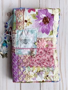 a small patchwork bag with flowers on it