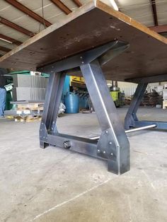 a metal table sitting inside of a garage