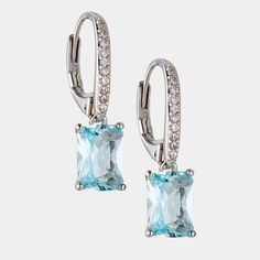 Striking and dramatic, these stunning emerald cut aquamarine-color drop earrings shimmer brightly when the light bounces off of the long, glamorous lines. ABOUT THE PRODUCT Metal: Sterling SilverPlating: RhodiumStones: Simulated Aquamarine-Colored GemstoneLength: 3/8 inWidth: 1/4 in Approximate diamond equivalent: 3.5 total carat weight Elegant Turquoise Jewelry With Rectangular Stone, Elegant Turquoise Rectangular Stone Jewelry, Elegant Aquamarine Drop Earrings, Elegant Turquoise Emerald Cut Jewelry, Elegant Turquoise Emerald-cut Jewelry, Elegant Aquamarine Baguette Cut Jewelry, Elegant Baguette Cut Aquamarine Jewelry, Aquamarine Color, Aquamarine Colour